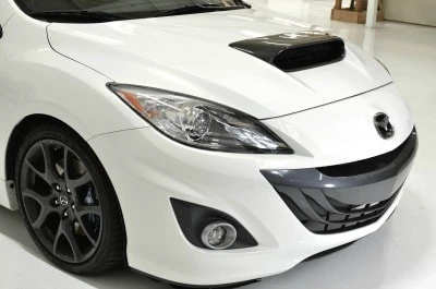 CorkSport's Mazdaspeed3 carbon hood scoop installed.