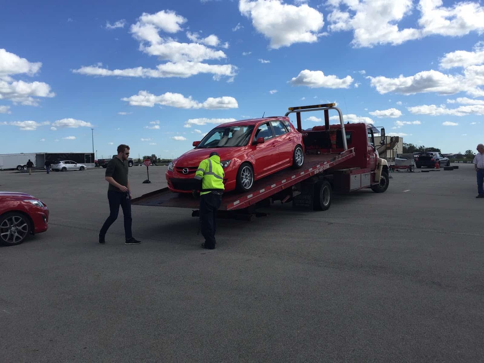 A Mazdaspeed gets towed from a NATOR event.