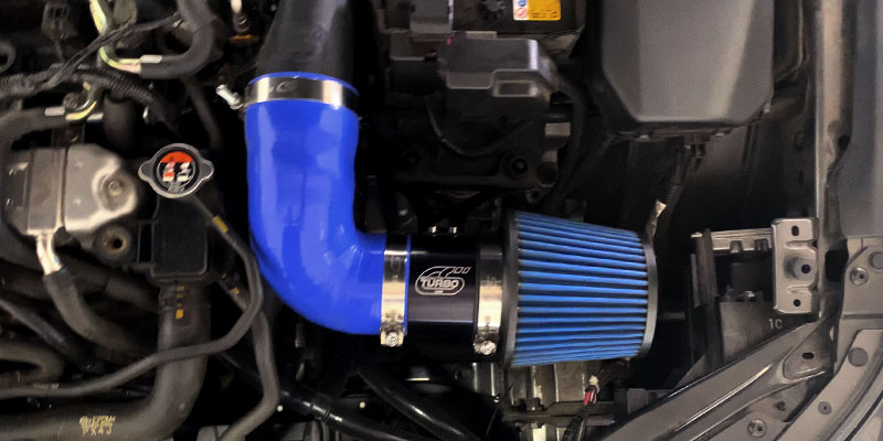 Short ram itnake system with turbo inlet pipe in blue on Mazda