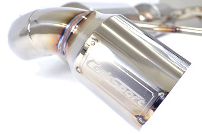 A closeup view of a tip for the 2014+ Mazda3 axle back exhaust for Sedans by CorkSport.