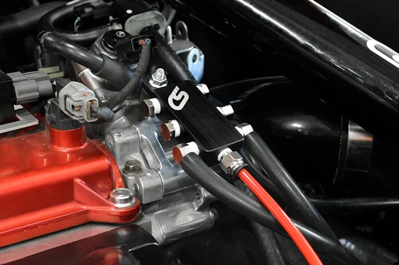 The Mazdaspeed 3 vacuum block helps clean up your engine bay