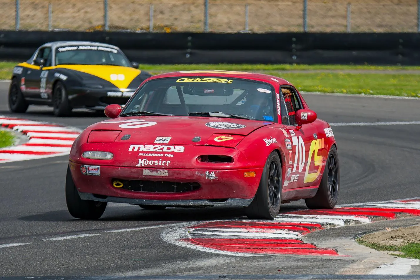 Mazda Miata racing in the curves