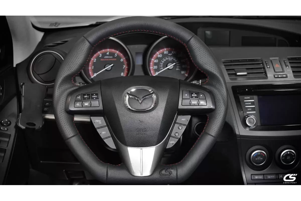 Upgrade the look of your interior with the CorkSport Leather Wrapped Steering Wheel for the 2010-2010 Mazdaspeed 3 and Mazda 3.