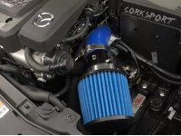 Blue silicone and filter shown with the black powder coated turbo inlet pipe and polished clamps installed on a Mazdaspeed6