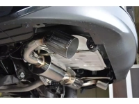 An angled view of the 2014+ Mazda 3 Sedan exhaust tip installed.