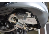 An angled view of the 2014+ Mazda 3 Sedan exhaust tip installed.