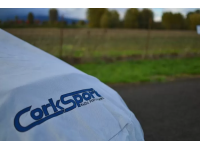 The car cover features a stylish screen printed logo