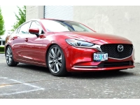 front postion on red Mazda 6 license plat relocation