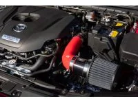 Red short ram intake in engine bay. Clean and simple install for power and turbo noises