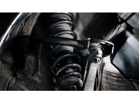 Spherical bushings replace the OEM rubber bushings for better handling feel.