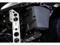 2.6 gallons of auxiliary methanol fuel fits snugly in front of your driver’s side front tire.