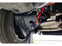 Red rear sway bar installed on Mazda