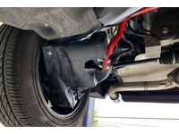 Red rear sway bar installed on Mazda