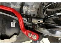 Close up of red sway bar installed on AWD Mazda